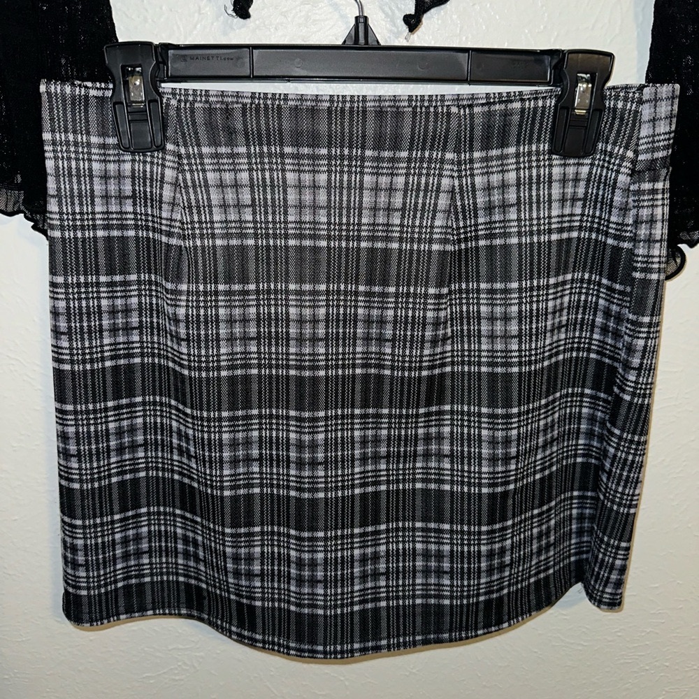 Black and White Plaid Mini Skirt with a Striped Pattern